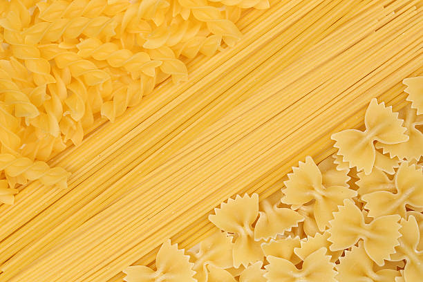 istock Noodles pasta spaghetti penne rigate background 468634856