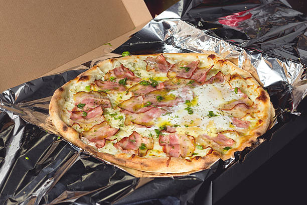 istock Freshly cooked  meat pizza with eggs pizza to delivery 468644374