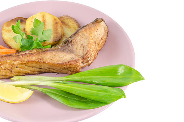 istock Grilled carp at dish isolated on white 468646858