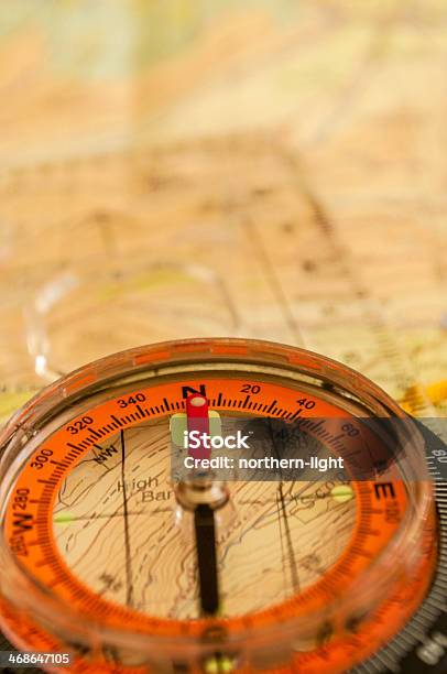 Closeup Of A Compass On A Topographic Map Stock Photo - Download Image Now - Adventure, Assistance, Cartography