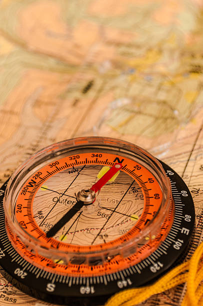 компас на карте - orienteering planning mountain climbing compass стоковые фото и изображения