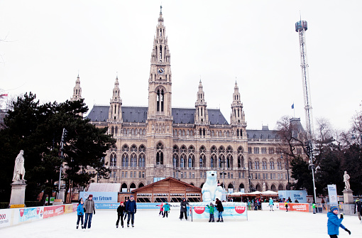 Vienna, Austria - February 4, 2015:  Ice skating people at the Wiener Eistraum (ice rink). The town government establishes every winter an ice rink in front of the Viennese city hall, Vienna, Austria.