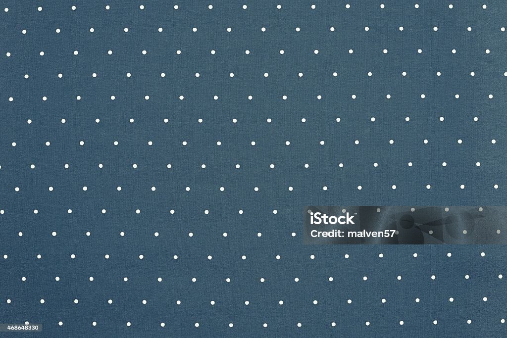 background of blue color with round specks the abstract textured background of blue color fabric and round light specks are located in ranks on a surface on all area 2015 Stock Photo