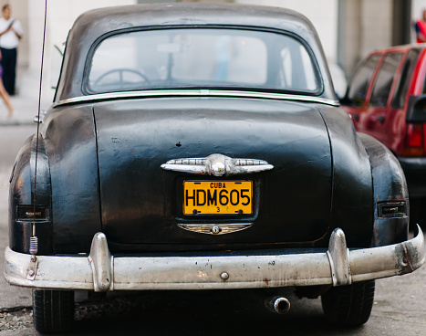 Havana, Cuba - September 6, 2014: An old, vintage black car in the streets of Havana, Cuba
