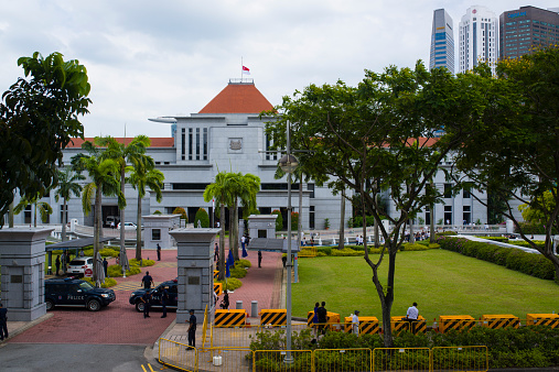 Singapore, Singapore - March 25, 2015: The state flag is at half-mast at the Parliament building. 