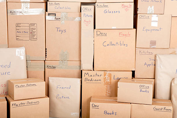 Moving boxes Wall with boses labled and ready fpr shiping physical activity stock pictures, royalty-free photos & images