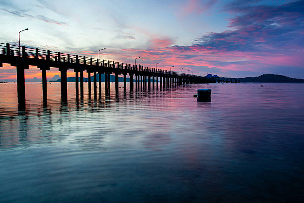 istock beautiful sunrise at the sea pier 468653588