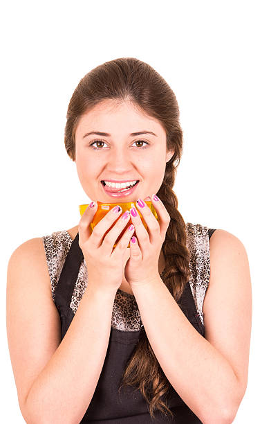 istock beautiful young girl eating fresh tomatoes 468657290