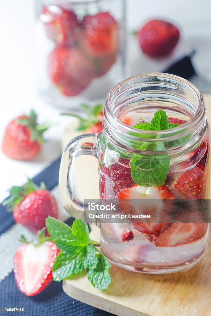 Strawberry Infused Water Mug delicious refreshing drink of strawberry on wooden, infused water 2015 Stock Photo