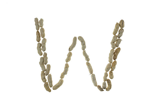 istock Letters made of peanuts on white 468657576