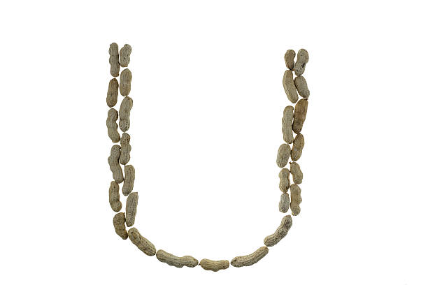 istock Letters made of peanuts on white 468657580