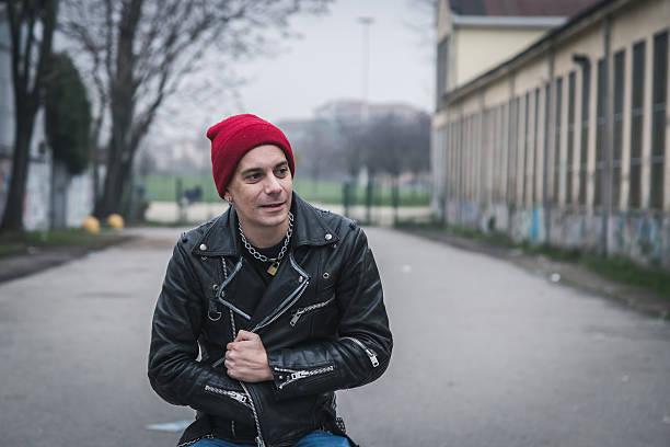 istock Punk guy posing in the city streets 468659110