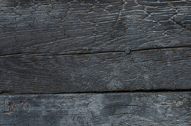 istock burnt wooden wall background texture 468659146