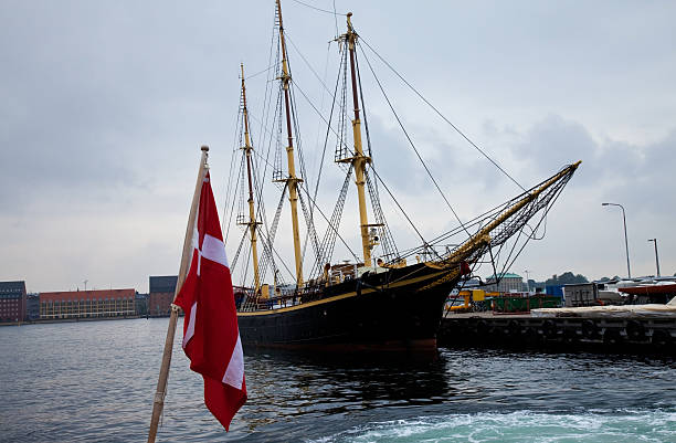 old ship with danish flag stock photo