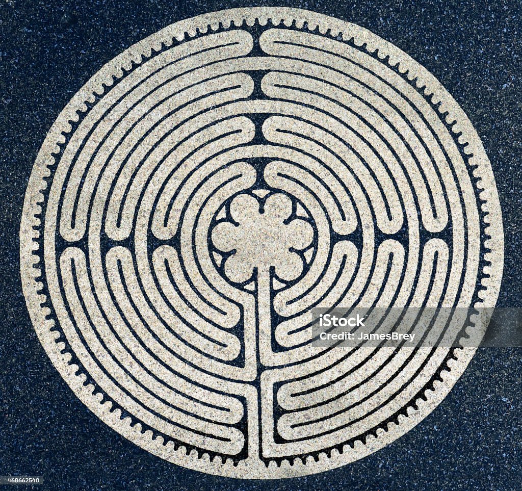 Ancient Round Labyrinth Symbol A labyrinth is an ancient symbol of wholeness. It combines the repeating shape of circles and a complex path inward. The Labyrinth represents the path to our own center, one's own perfect place in the world. Maze Stock Photo