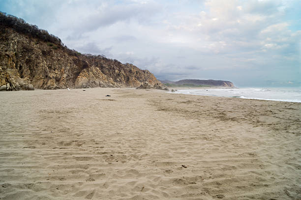 istock Lonely beach and cliff in overcast day 468666232