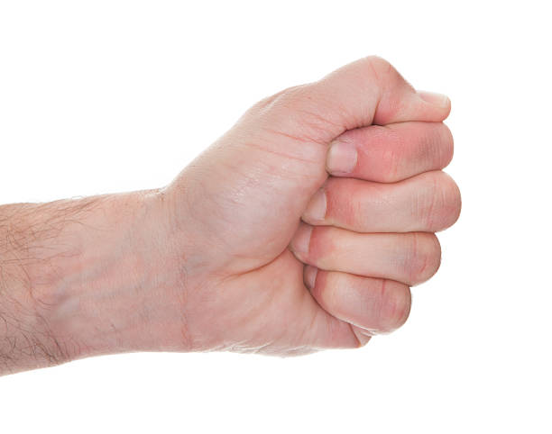 istock Close-up Man's Hand Clenching His Fist 468666613