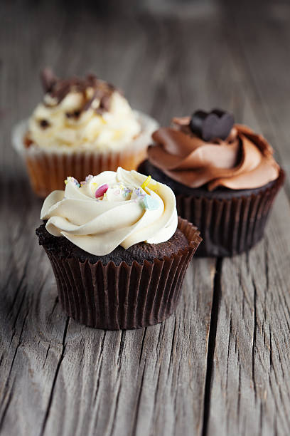 istock Chocolate cupcake on wooden table 468668116