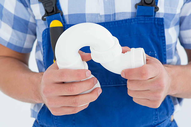 istock Plumber holding sink pipe on white background 468671084