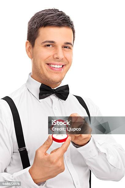 Elegant Young Man Holding An Engagement Ring Stock Photo - Download Image Now - 20-29 Years, 2015, Adult