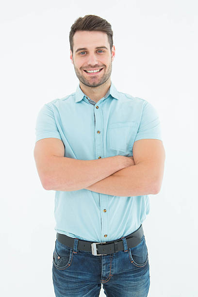 istock Confident young man standing arms crossed 468672374