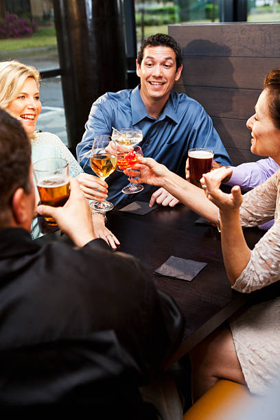 istock Group of friends having drinks at restaurant 468672375