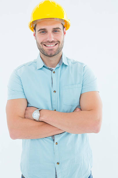 istock Happy male architect standing arms crossed 468673136