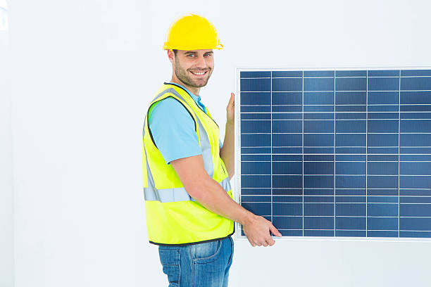 istock Portrait of happy architect holding solar panel 468676802