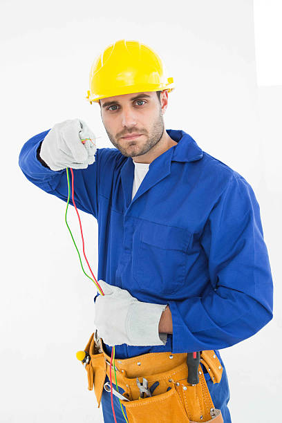 istock Confident repairman holding cables 468679092