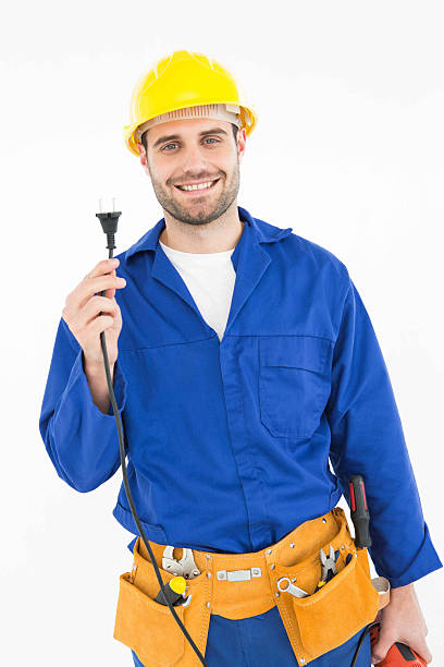 istock Smiling repairman holding electric plug 468679112
