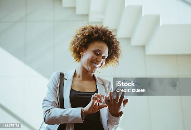 Afro American Woman Using A Digital Tablet Stock Photo - Download Image Now - Ecstatic, Excitement, Using Digital Tablet
