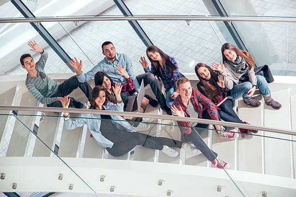 istock Medium group of  students studying on steps of school building. 468681326