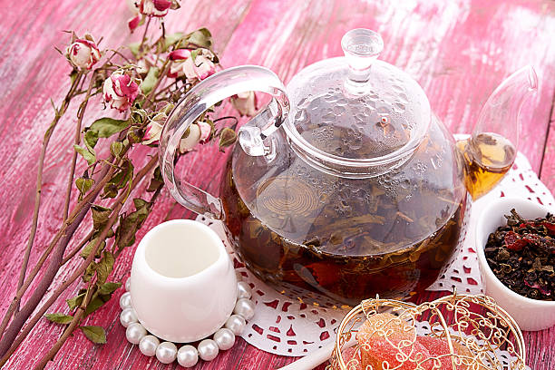 istock drink in glass teapot on wooden background 468683726