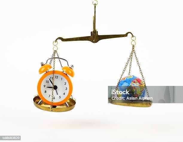 Earth And Clock On Balance Scale Stock Photo - Download Image Now - 2015, Accuracy, Africa