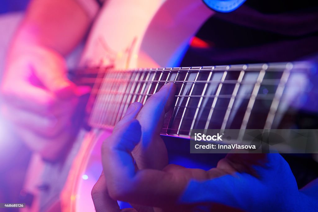 Close up of hands playing a guitar rockstar playing solo on guitar Live Event Stock Photo