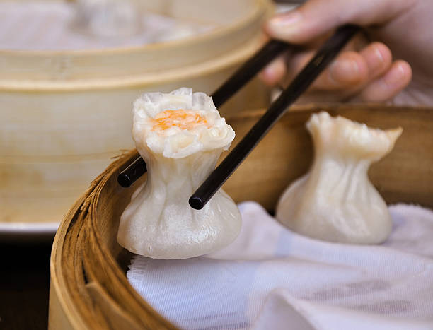 istock Chinese dumpling Shumai with shrimp in a basket 468685786