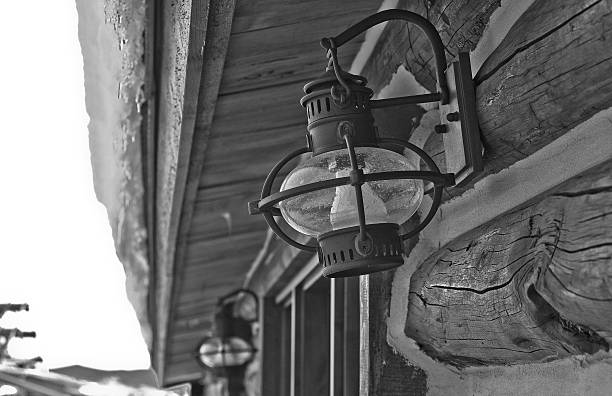 istock Old Fashioned Lamp on Exterior of Log Cabin 468687012