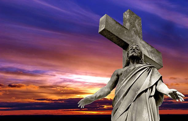 istock crucified Jesus Christ against dramatic sunset 468690052