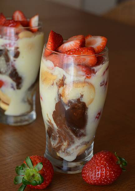istock Vanilla mousse dessert with chocolate and cookies in glass 468690214