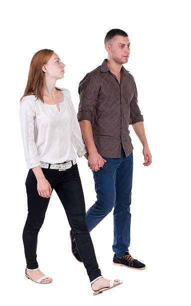 istock Back view going couple in shorts. 468690924