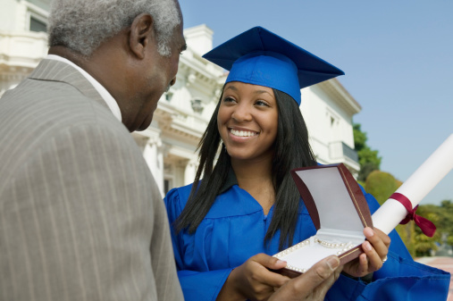 Father Giving Daughter Graduation Gift
