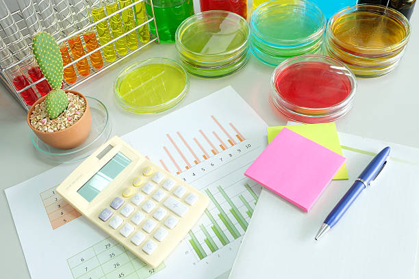 istock calculator and chart with colorful fluid in glassware 468698208