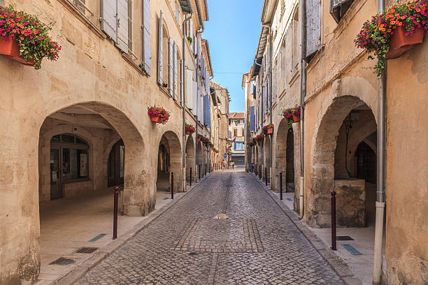 Tarascon stretches on the left bank of the Rhone river in the Provence-Alpes-Cote d'Azur region. Its main sight is the castle, a massive fortress built on the banks of the river by the family of Anjou, in the first half of the fifteenth century. Another landmark is the Église collégiale Ste Marthe (St Martha's Collegiate Church), built in the Romanesque style in 1197 and enlarged in the sixteenth and fifteenth in the Gothic style.
