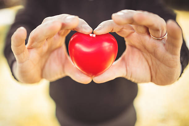 istock holding a red heart for st. valentine 468699319