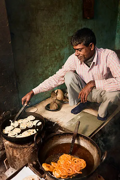 Indian street vendor preparing food - jalebi, Rajasthan, India. http://bem.2be.pl/IS/rajasthan_380.jpg