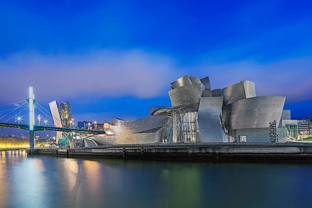 Bilbao, Spain - March 30, 2015: Guggenheim Museum Bilbao at night. Guggenheim Museum Bilbao is a museum of modern and contemporary art designed by Canadian-American architect Frank Gehry in 1997, located in Bilbao, Basque Country, Spain