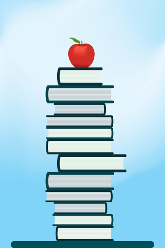 Book tower with red apple on the top
