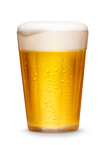 Cold beer with foam served in small glass