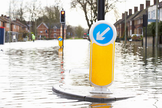istock Flooded Urban Road With Traffic Lights 468714632