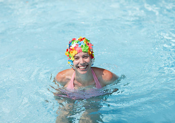Midadult Woman Wearing Colorful Swimcap In Swimming Pool Stock Photo -  Download Image Now - iStock